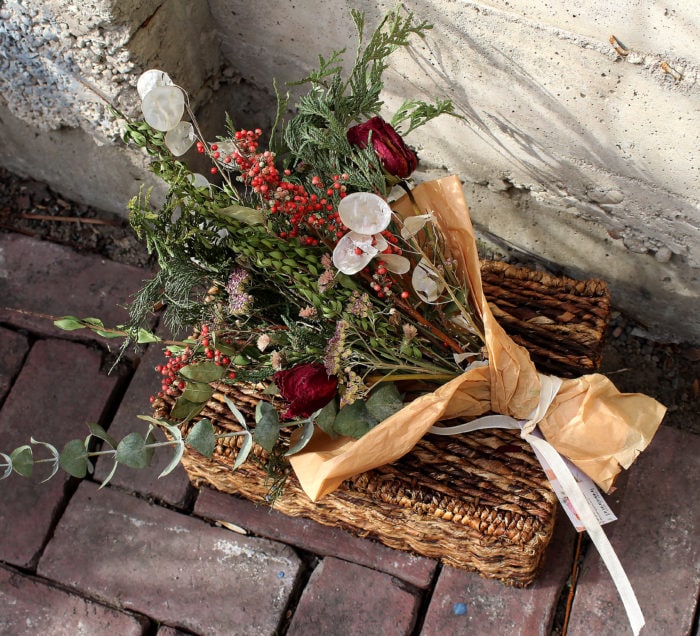 Red, white, and green dried flower bouquet