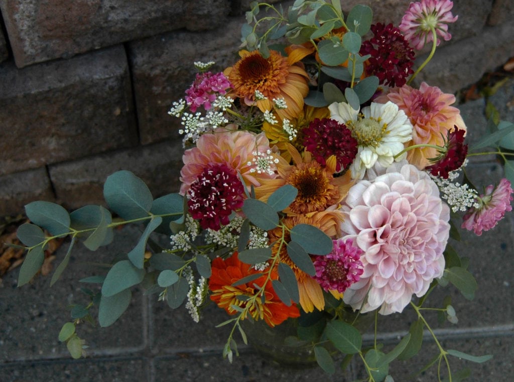 Zinnia and assorted flower arrangement from top angle
