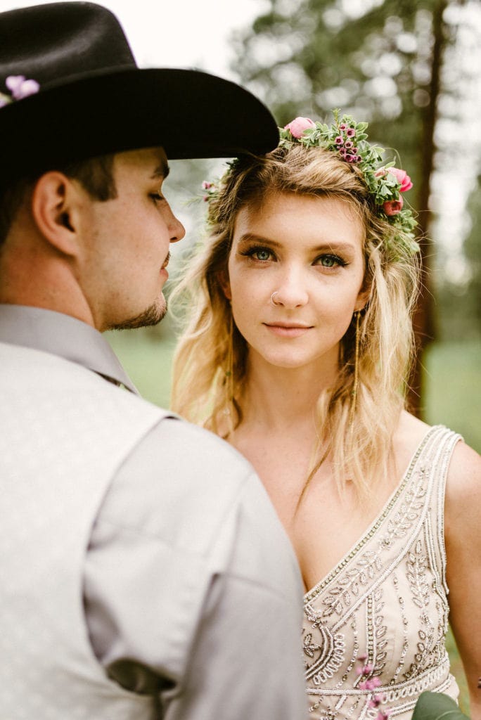 bride facing with crown with cowboy groom facing her