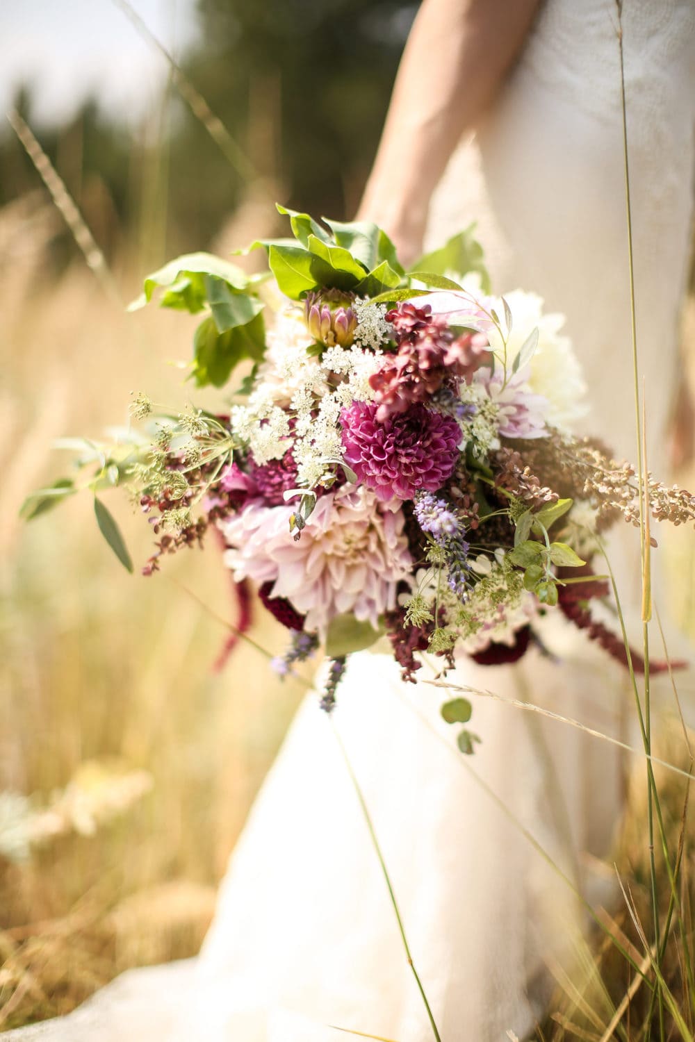 wildflower dahlia bridal bouquet with eggplant, magenta and blush hues