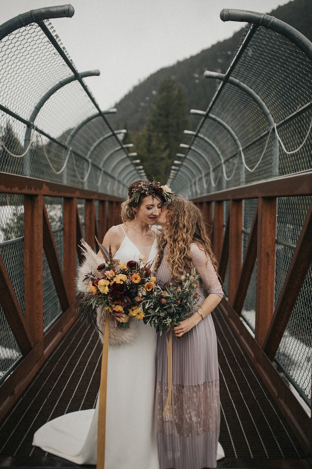 Bride and bridesmaid holding bouquets