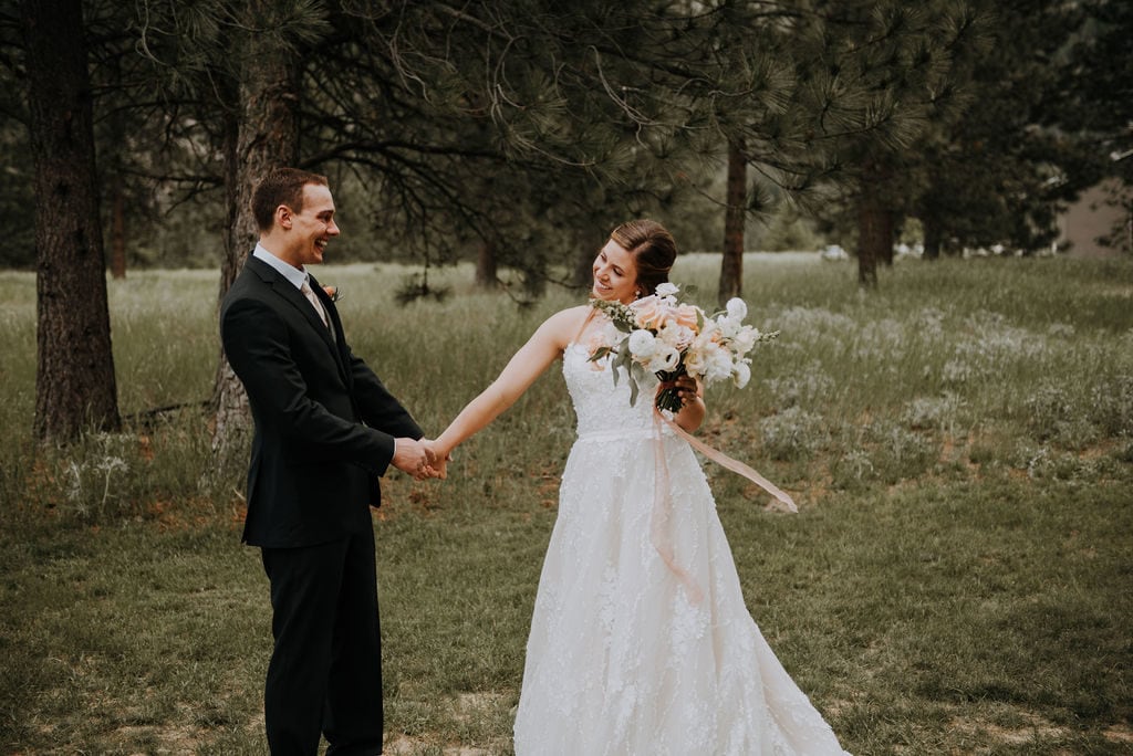 bride and groom holding hands