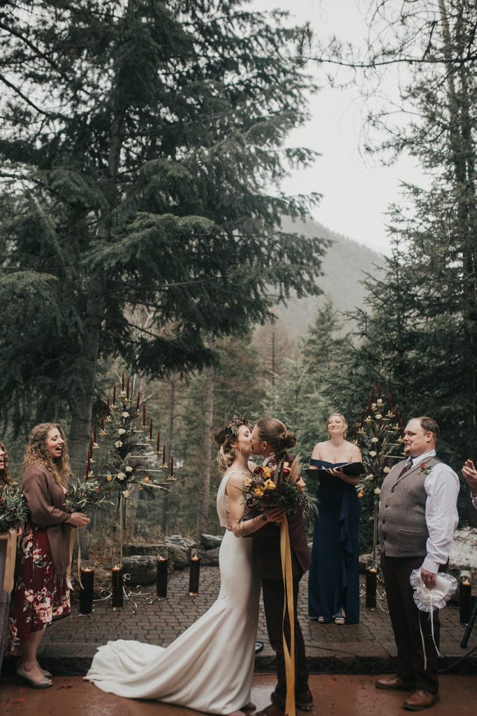 Bride and groom kiss during Montana wedding