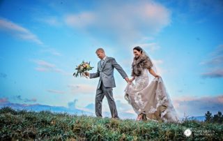 Bride and groom against texture sky
