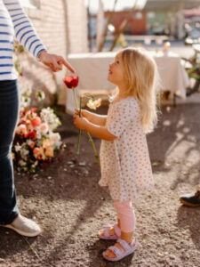 little girl holding tulip